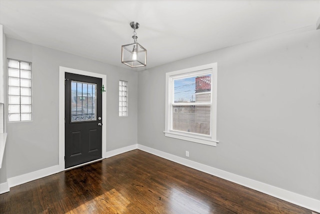 foyer entrance with dark hardwood / wood-style floors