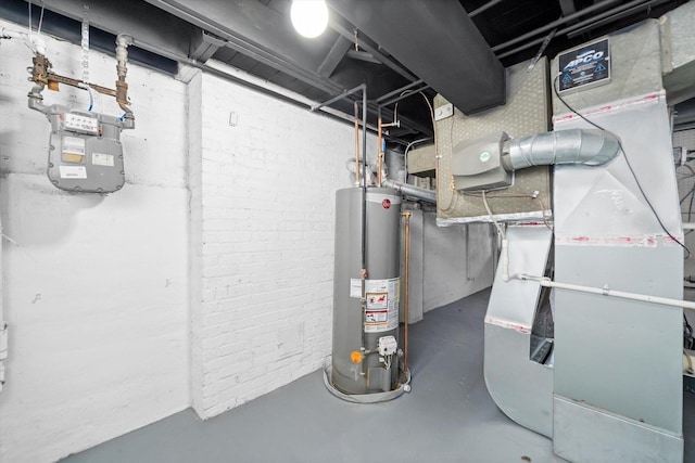 utility room featuring heating unit and gas water heater