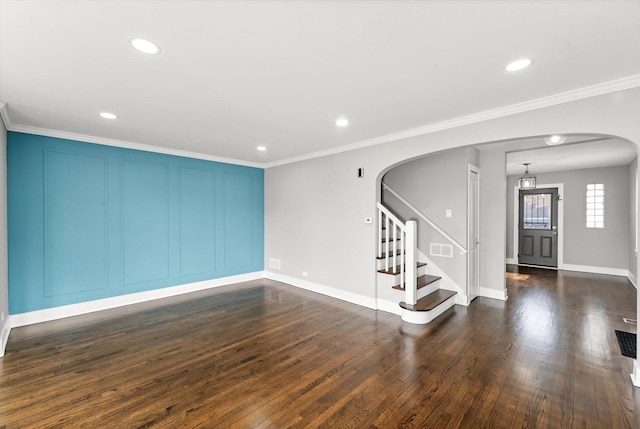 unfurnished room with ornamental molding and dark hardwood / wood-style floors