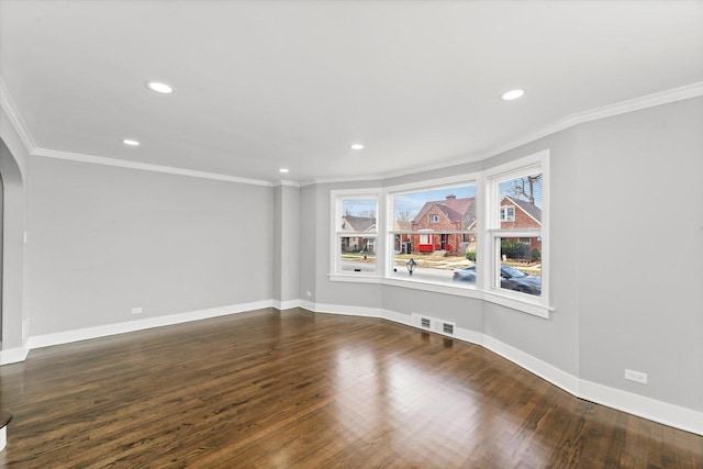 spare room with wood-type flooring and ornamental molding