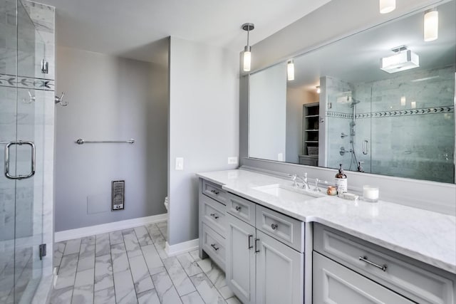 bathroom featuring walk in shower, vanity, and toilet