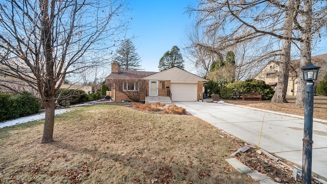 view of front of property featuring a garage and a front lawn