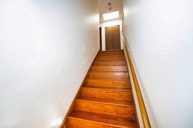 staircase with a skylight