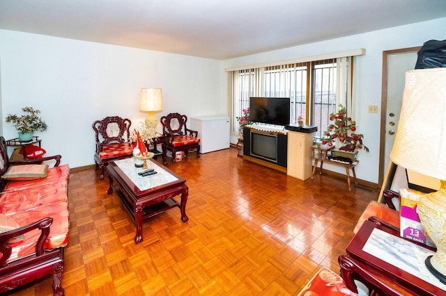 living room featuring parquet flooring