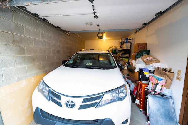 garage featuring a garage door opener