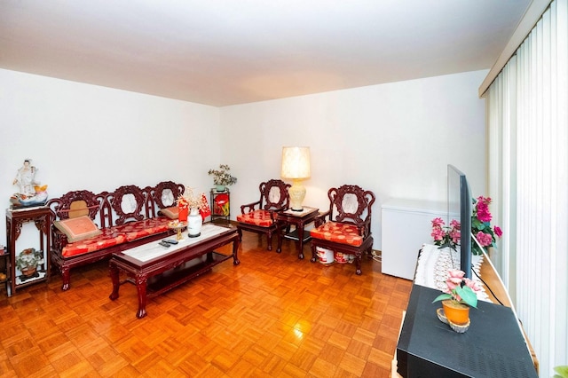 living room featuring parquet floors