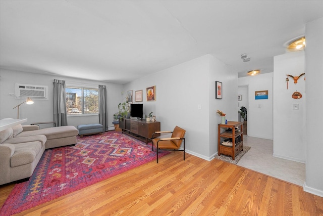 living room with hardwood / wood-style flooring and a wall mounted AC