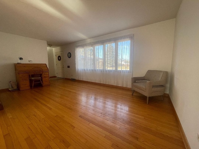 unfurnished room with light wood finished floors