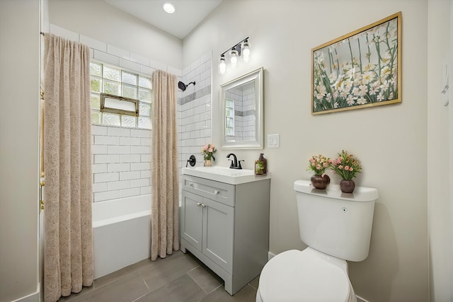 full bathroom featuring shower / tub combo, vanity, and toilet