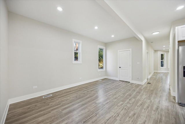 unfurnished room featuring light hardwood / wood-style flooring