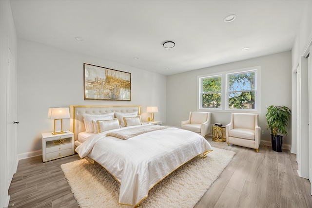 bedroom with light hardwood / wood-style flooring