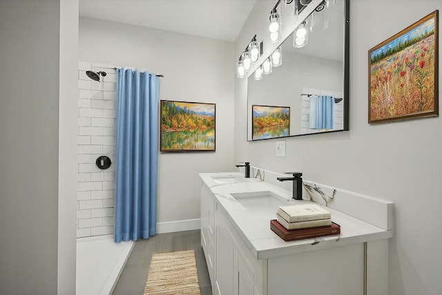 bathroom featuring vanity and a tile shower