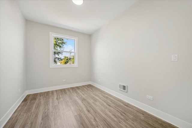 spare room with light wood-type flooring