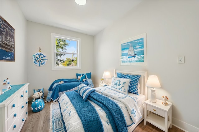 bedroom with wood-type flooring