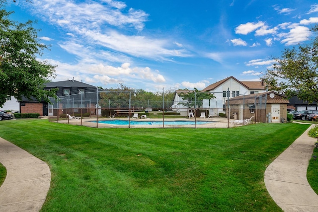 view of yard featuring a community pool