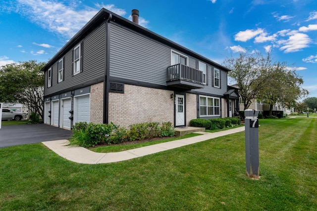 view of property exterior featuring a balcony, a garage, and a yard