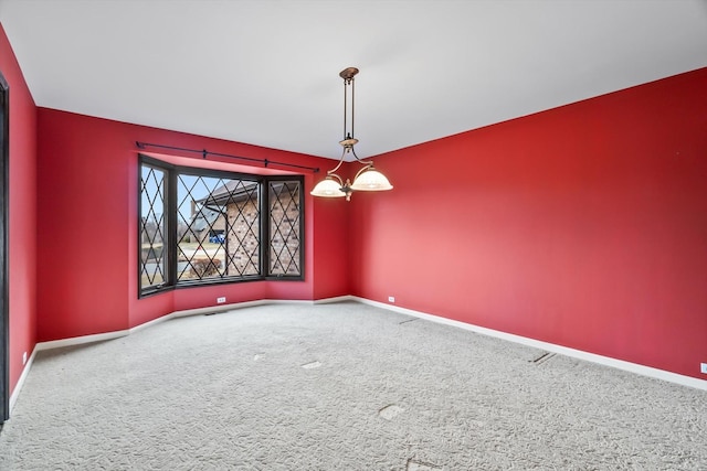 interior space with an inviting chandelier and carpet floors