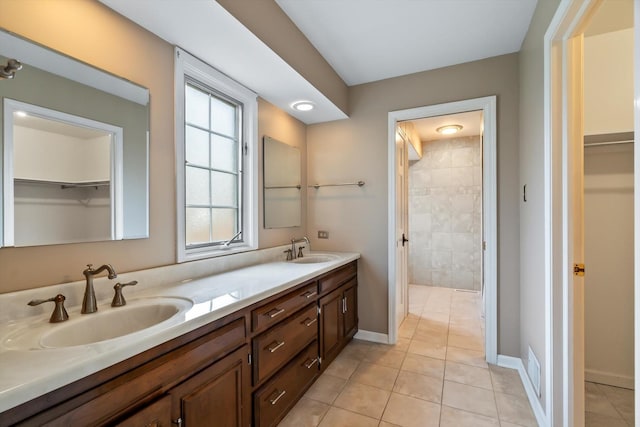 bathroom with vanity and tile patterned floors