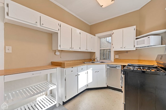 kitchen featuring white cabinetry, sink, ornamental molding, and appliances with stainless steel finishes