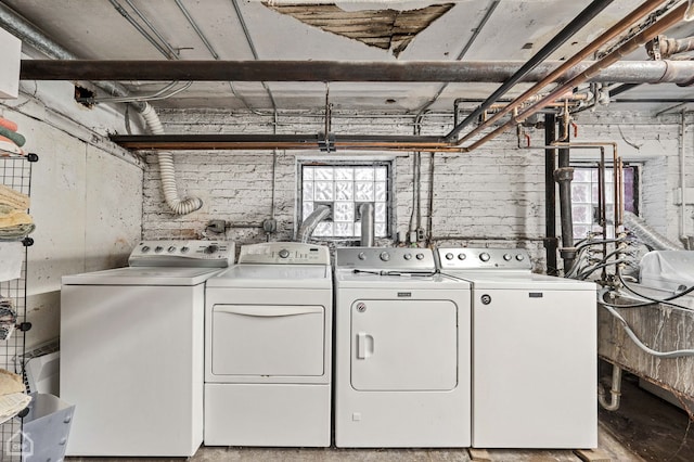 laundry area with washing machine and dryer