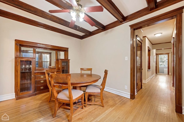 dining space featuring crown molding, ceiling fan, beam ceiling, and light hardwood / wood-style flooring