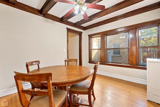 dining area with beam ceiling, ceiling fan, and light wood-type flooring