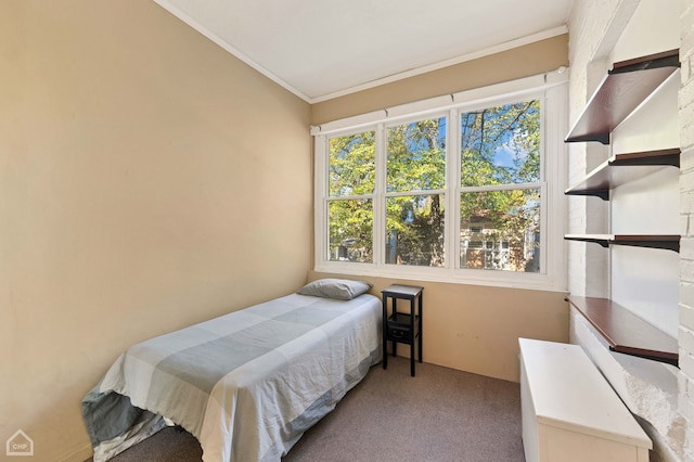 bedroom featuring ornamental molding and light colored carpet