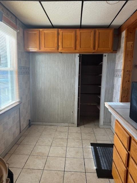 kitchen featuring a healthy amount of sunlight and light tile patterned flooring