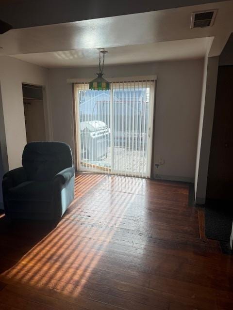 dining area with plenty of natural light and dark hardwood / wood-style floors