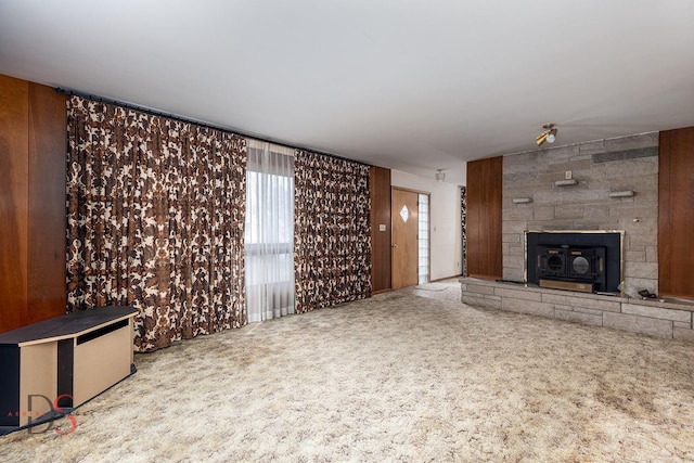 unfurnished living room featuring carpet floors