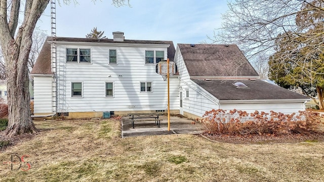 rear view of property with a yard, a patio, and central air condition unit