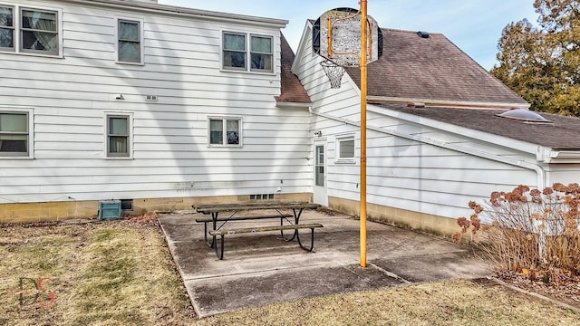 rear view of house with cooling unit and a patio area