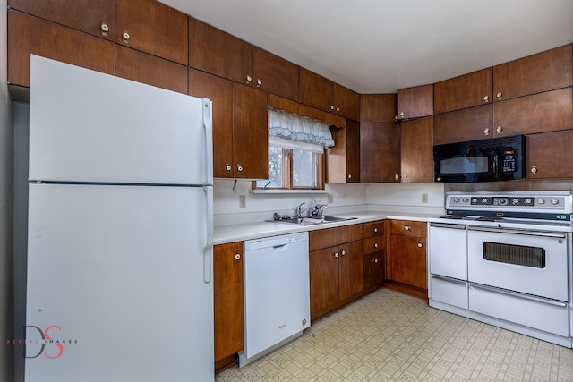 kitchen with white appliances and sink