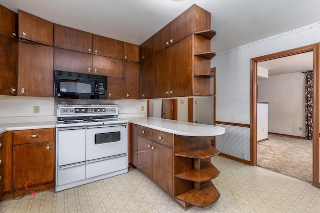 kitchen featuring double oven range and kitchen peninsula