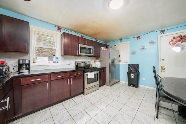 kitchen featuring stainless steel appliances and backsplash