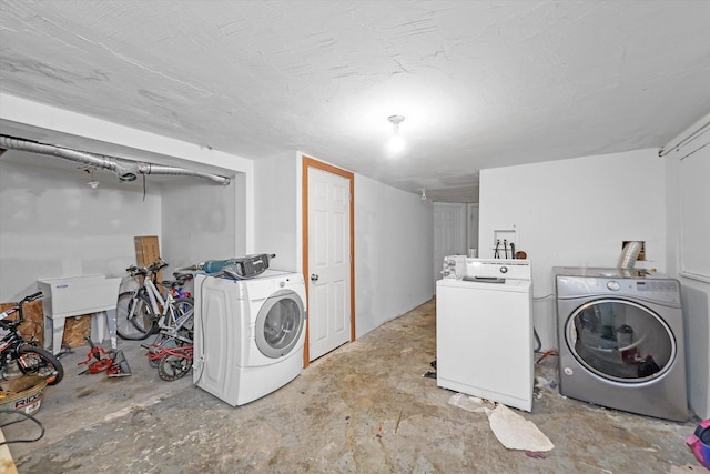 washroom with washing machine and clothes dryer