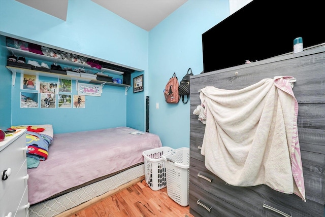 bedroom with hardwood / wood-style flooring