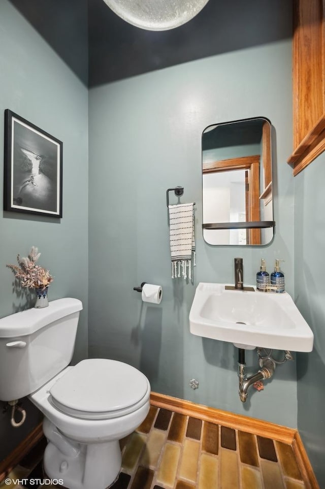 bathroom with sink and toilet