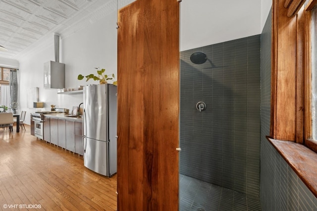 kitchen featuring light wood-type flooring and appliances with stainless steel finishes