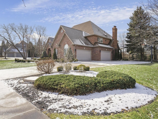 view of side of property featuring a garage and a lawn