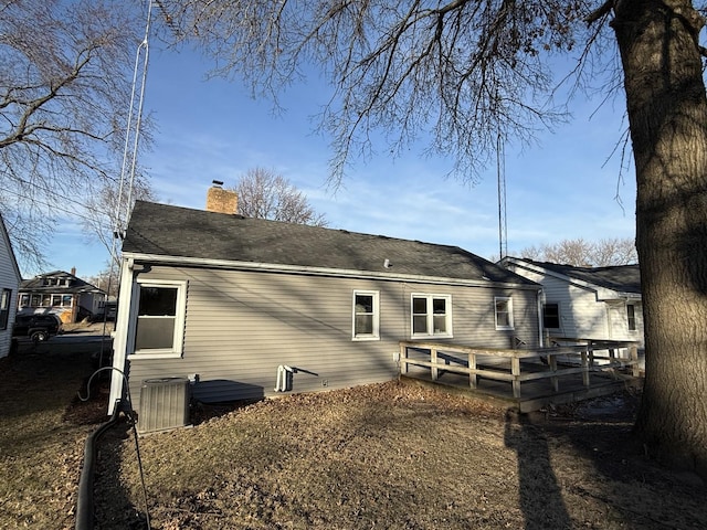 back of property with a wooden deck