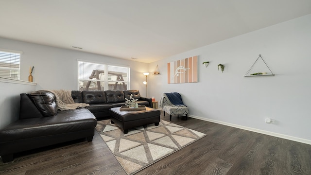 living room featuring dark wood-type flooring