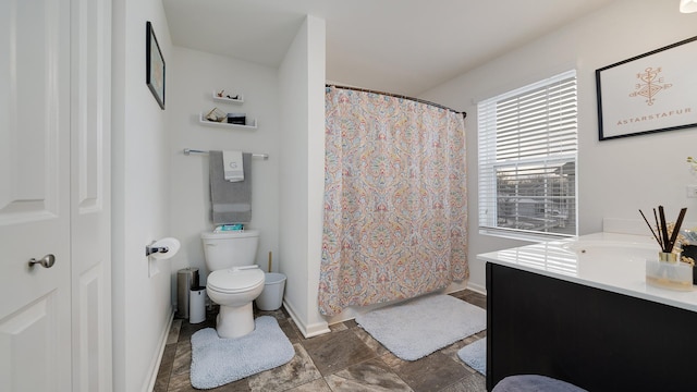 bathroom with vanity, toilet, and a shower with shower curtain