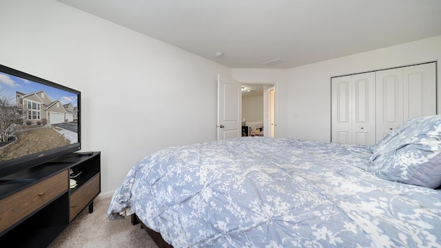 carpeted bedroom with a closet