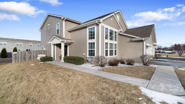 view of front facade featuring a garage and a front lawn