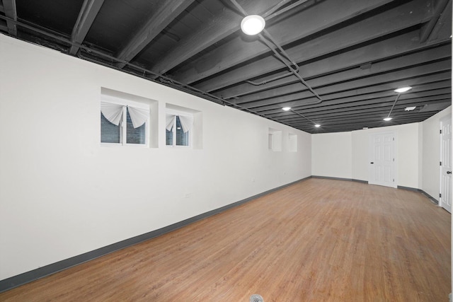 basement featuring wood-type flooring