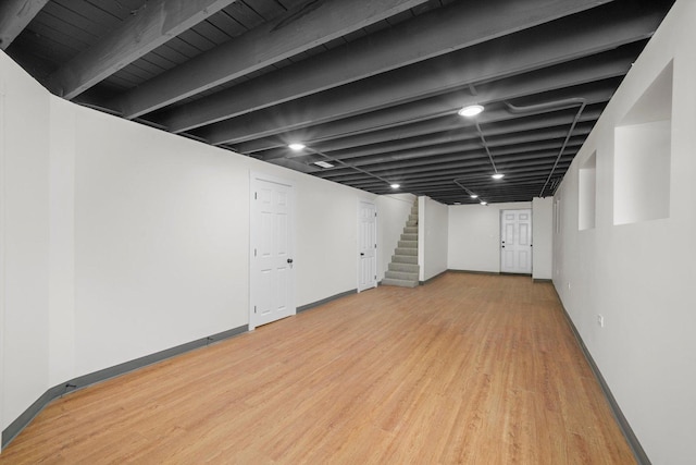 basement featuring light wood-type flooring