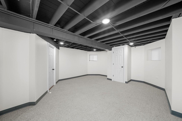 basement with light colored carpet