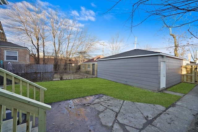 view of yard with a storage shed and a patio area