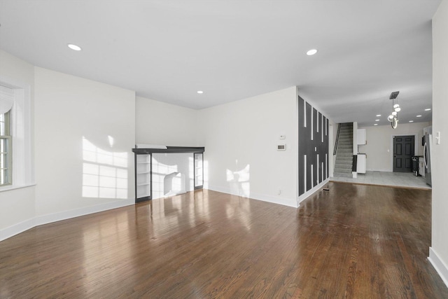 unfurnished living room featuring hardwood / wood-style flooring